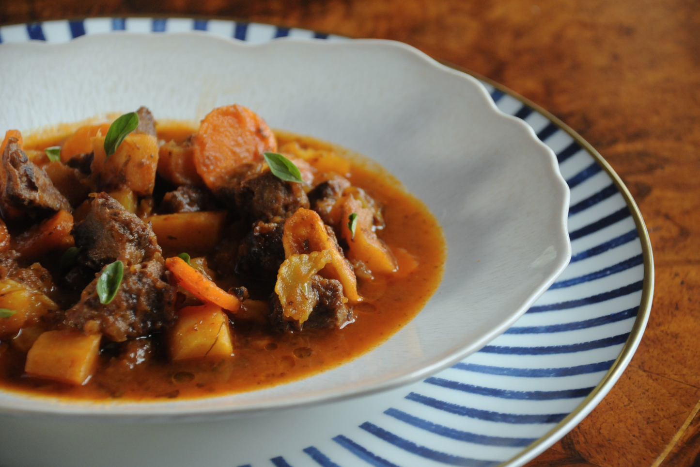 Close-up of slow-braised beef cheek goulash made by an Algarve chef using classic European technique