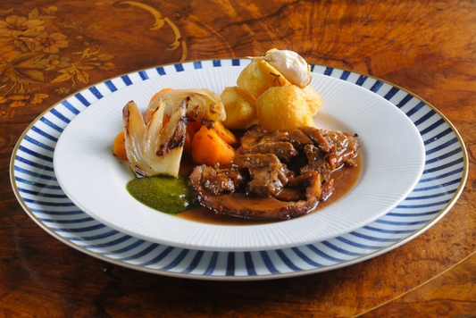 Slow cooked rolled lamb shoulder with Jerusalem spices, chef prepared gourmet ready meal in the Algarve