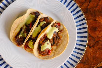 Adobo Beef Taco kit, frozen ready meal delivered across the Algarve — overhead view with avocado crema and grilled peppers